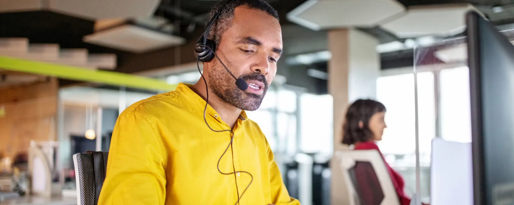 Customer support operator assisting customer   1800x720